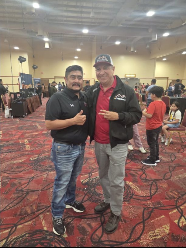 Mr Painting Houses team with a fellow contractor at an industry event
