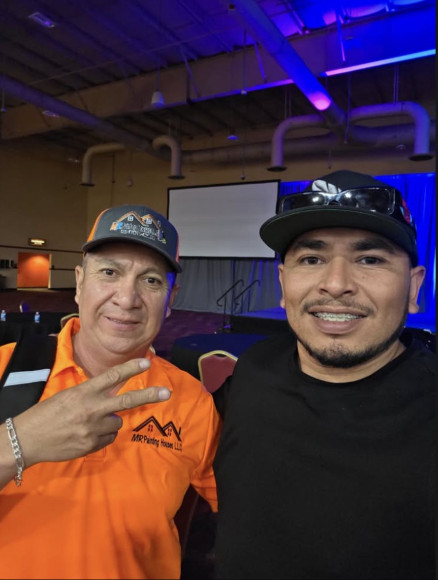 Mr Painting Houses team member in a company polo at a trades event