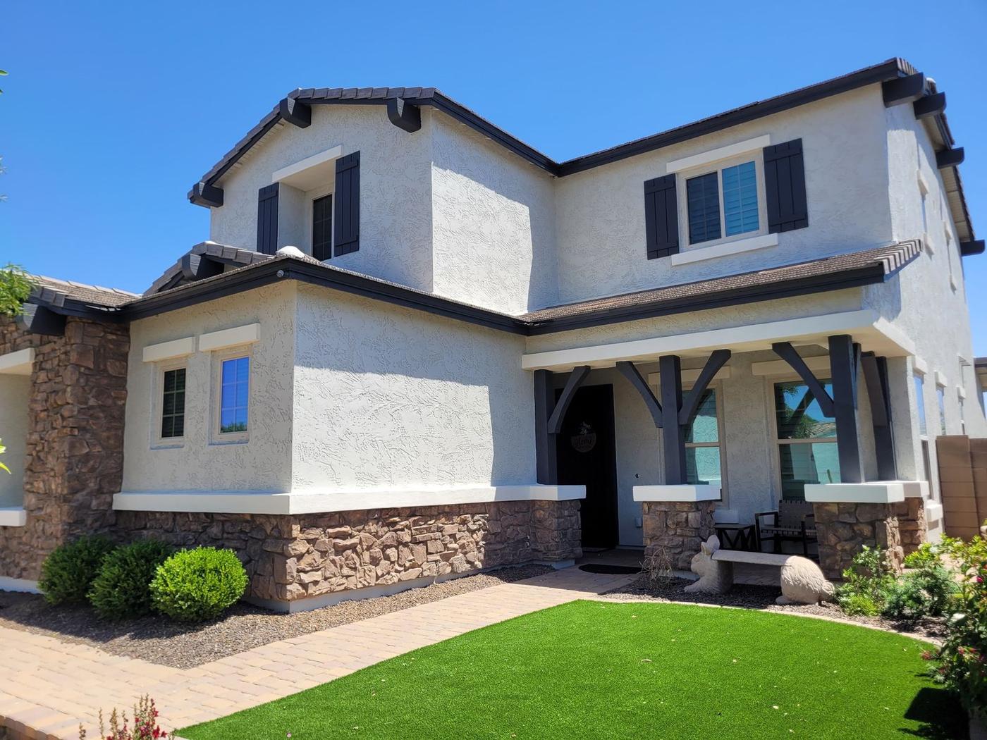 Two-story stucco and stone exterior
